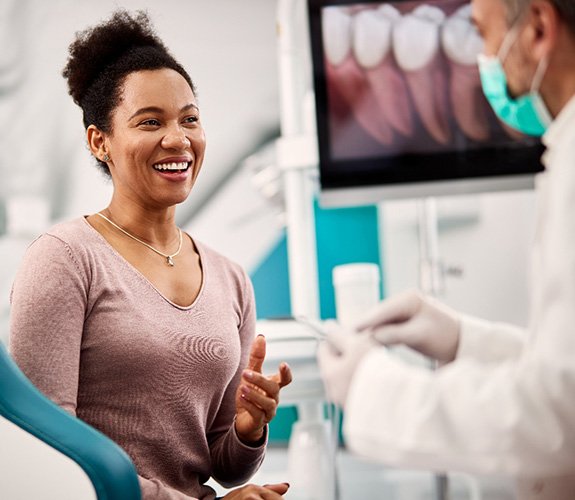 Dentist discussing the cost of a root canal treatment in Lake Zurich