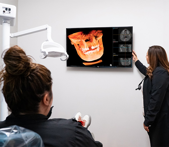 Dentist taking to young patient