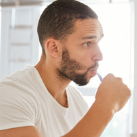 Man brushing his teeth