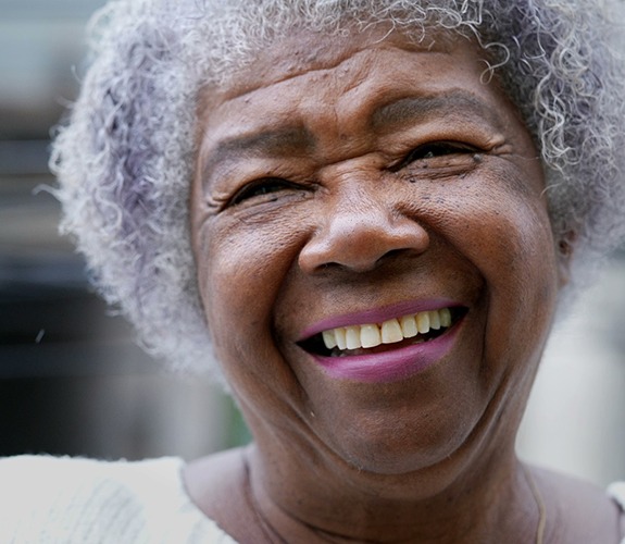 Woman smiling with dentures in Lake Zurich