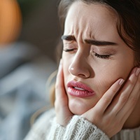 Woman experiencing tooth pain