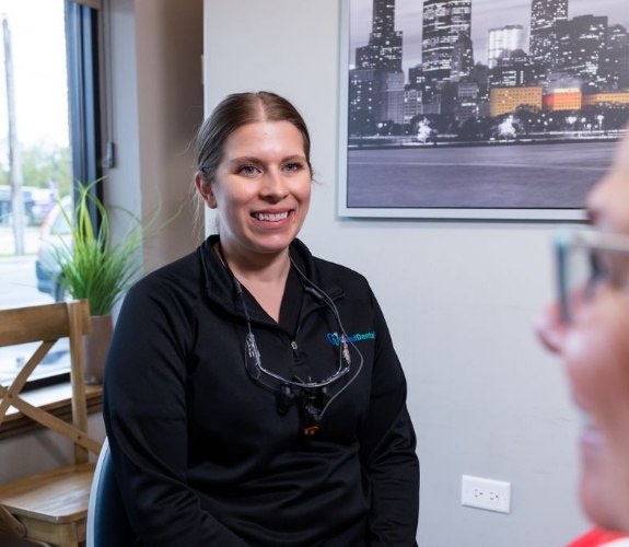 A woman with a toothache visiting her dentist