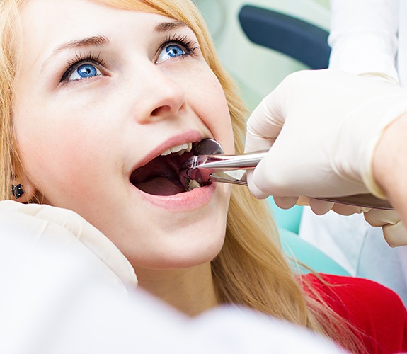 Patient undergoing tooth extraction