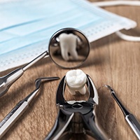 Extracted tooth and dental instruments