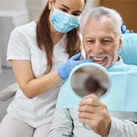 Man smiling with dental implants in Lake Zurich