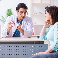 Dentist discussing treatment with a patient