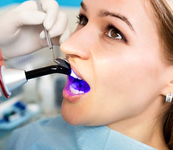Woman receiving tooth-colored fillings in Lake Zurich