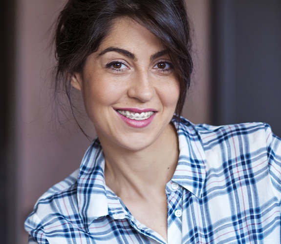 Woman with adult orthodontics smiling