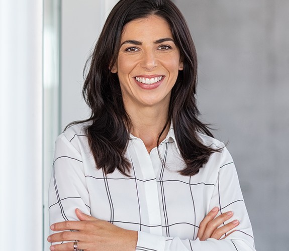 Woman with flawless smile after advanced periodontal procedures