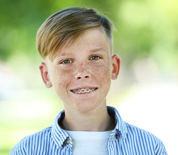 young boy outside with Phase 1 orthodontics in Lake Zurich, IL
