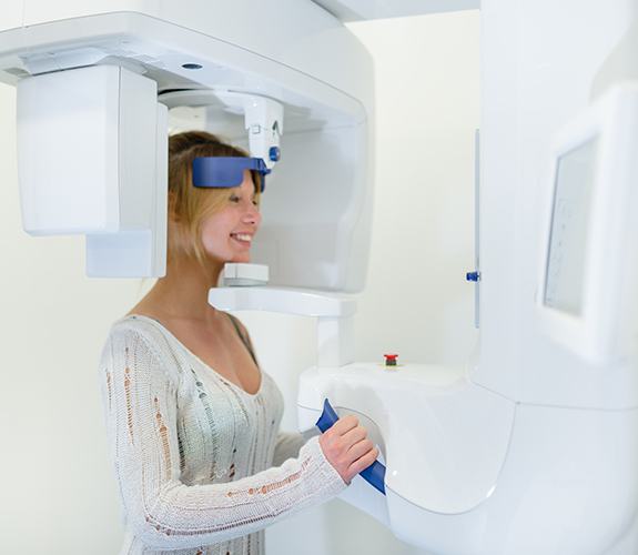 Patient receiving C T cone beam x-ray scans