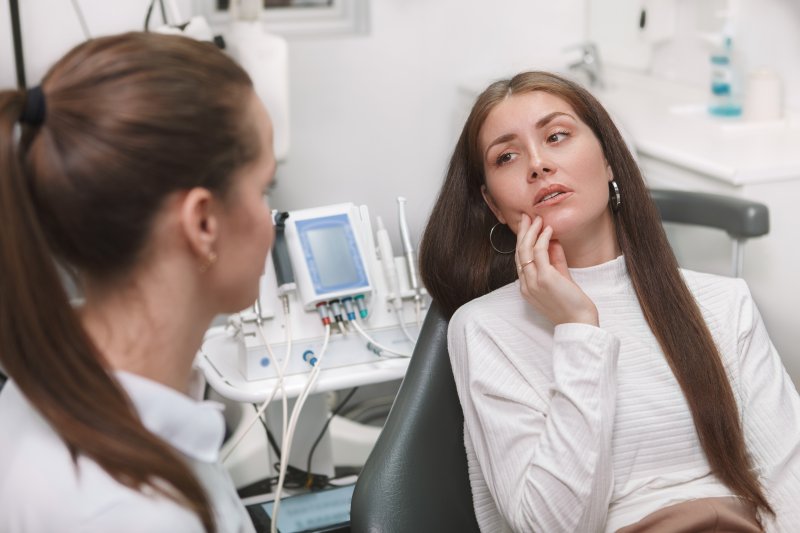 young woman with a dental emergency