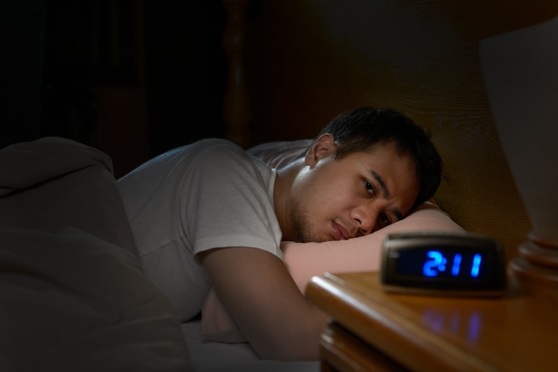 man awake in the middle of the night