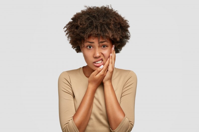 woman with serious tooth pain